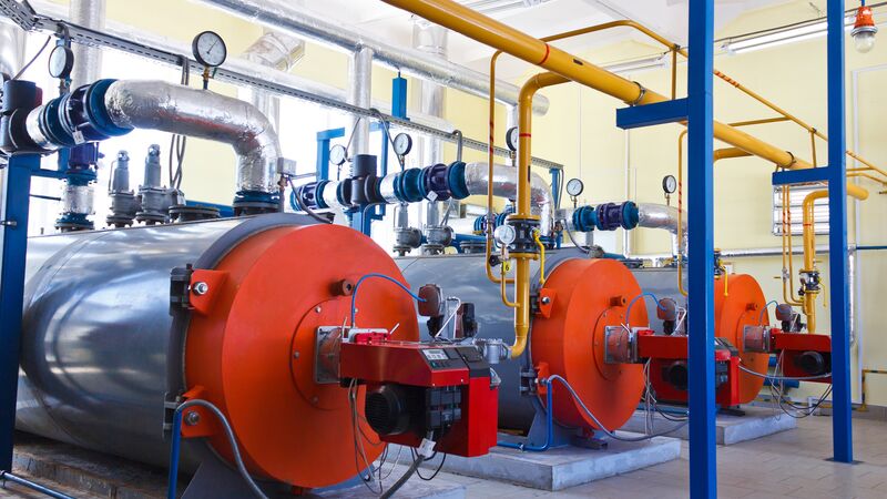 Industrial boiler system with insulated pipes and pressure gauges